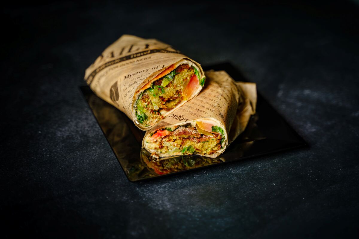 Falafel wrap with fresh vegetables and tahini